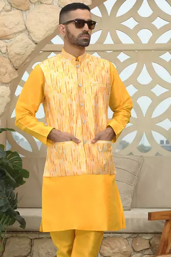 Silk blend solid yellow kurta and churidar with tie-dye yellow nehru jacket