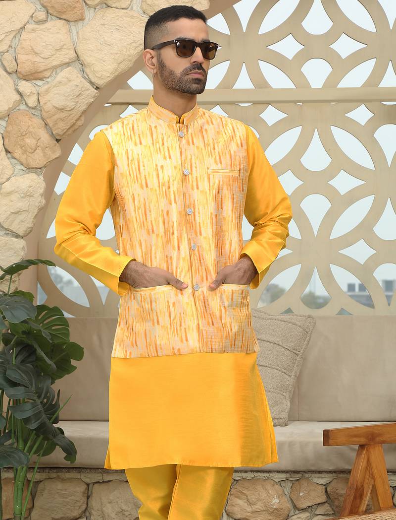 Silk blend solid yellow kurta and churidar with tie-dye yellow nehru jacket