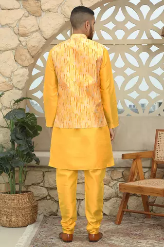 Silk blend solid yellow kurta and churidar with tie-dye yellow nehru jacket