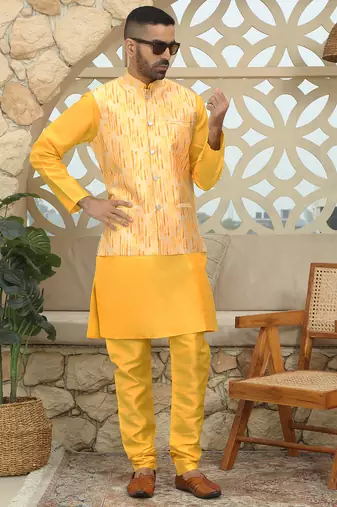 Silk blend solid yellow kurta and churidar with tie-dye yellow nehru jacket
