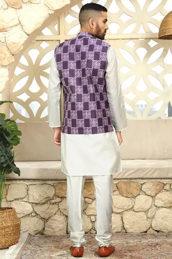Silk blend solid cream kurta and churidar with purple printed nehru jacket