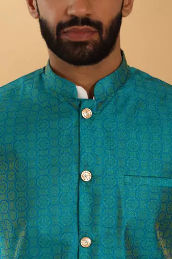 Silk blend cream kurta and churidar with jacquard geometric turquoise nehru jacket