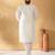 Silk blend cream kurta and churidar with jacquard geometric beige nehru jacket