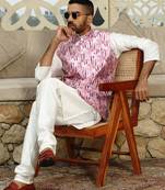 Silk blend solid cream kurta and churidar with tie-dye wine nehru jacket