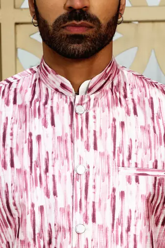 Silk blend solid cream kurta and churidar with tie-dye wine nehru jacket
