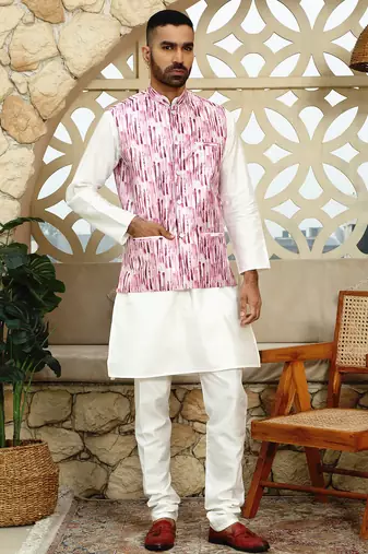 Silk blend solid cream kurta and churidar with tie-dye wine nehru jacket