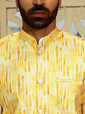 Silk blend solid cream kurta and churidar with tie-dye yellow nehru jacket 2