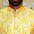 Silk blend solid cream kurta and churidar with tie-dye yellow nehru jacket