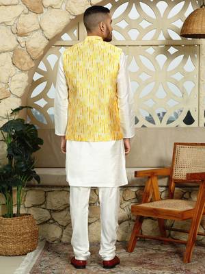 Silk blend solid cream kurta and churidar with tie-dye yellow nehru jacket 3