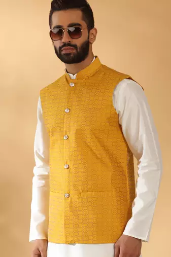 Silk blend cream kurta and churidar with jacquard geometric mustard nehru jacket