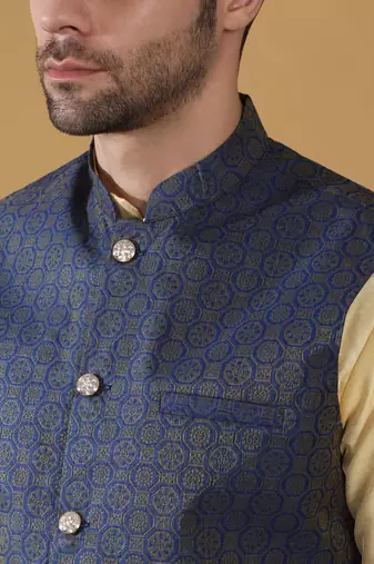 Silk blend beige kurta and churidar with jacquard geometric blue nehru jacket