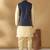 Silk blend beige kurta and churidar with jacquard geometric blue nehru jacket