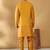 Silk blend mustard kurta and churidar with jacquard geometric nehru jacket