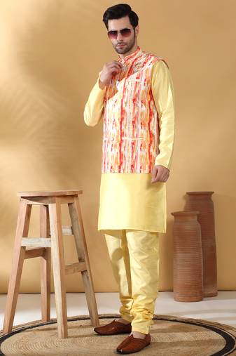 Silk blend lime yellow kurta and churidar with tie-dye orange nehru jacket