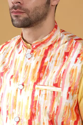 Silk blend lime yellow kurta and churidar with tie-dye orange nehru jacket