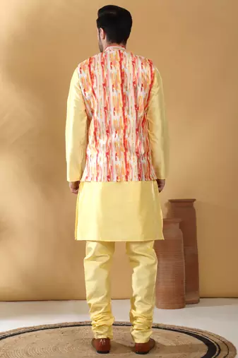 Silk blend lime yellow kurta and churidar with tie-dye orange nehru jacket