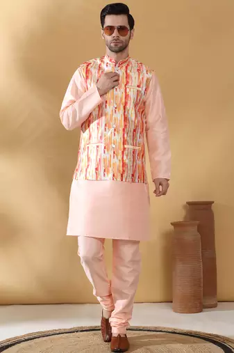 Silk blend peach kurta and churidar with tie-dye orange nehru jacket