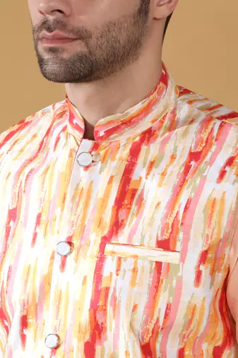 Silk blend peach kurta and churidar with tie-dye orange nehru jacket
