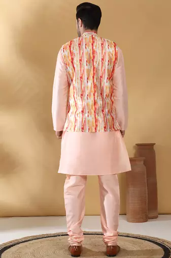 Silk blend peach kurta and churidar with tie-dye orange nehru jacket