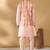 Silk blend peach kurta and churidar with tie-dye orange nehru jacket