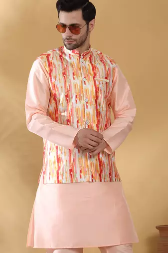 Silk blend peach kurta and churidar with tie-dye orange nehru jacket