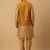 Men's gold kurta and churidar with jacquard ethnic nehru jacket