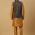 Men's mustard kurta and churidar with jacquard ethnic motifs printed nehru jacket