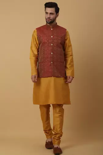 Men's mustard kurta and churidar with jacquard ethnic motifs printed nehru jacket
