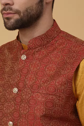 Men's mustard kurta and churidar with jacquard ethnic motifs printed nehru jacket