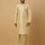 Men's beige kurta and churidar with jacquard ethnic motifs printed nehru jacket