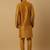 Men's mustard kurta and churidar with jacquard floral nehru jacket