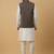 Men's cream kurta and churidar with jacquard ethnic motifs printed nehru jacket