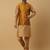 Men's gold kurta and churidar with jacquard floral nehru jacket