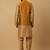 Men's gold kurta and churidar with jacquard floral nehru jacket