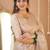 beige handloom tissue saree with designer blouse