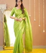 pista green handloom tissue saree with designer blouse