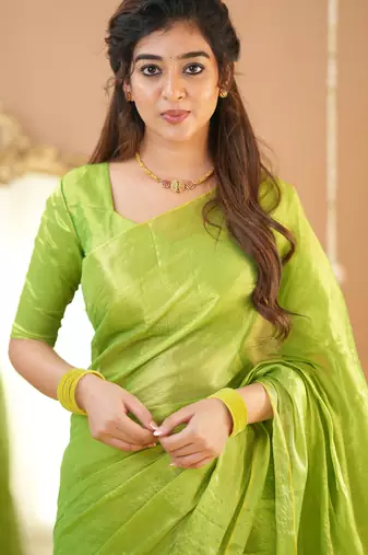 pista green handloom tissue saree with designer blouse