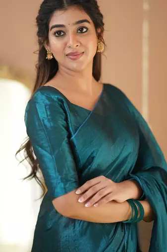teal green handloom tissue saree with designer blouse
