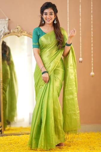 pista green handloom tissue saree with designer blouse