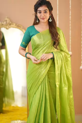 pista green handloom tissue saree with designer blouse