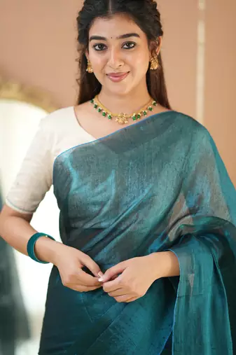 teal green handloom tissue saree with designer blouse