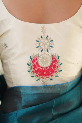 teal green handloom tissue saree with designer blouse