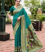 Green woven floral silk blend zari weaving paithani saree