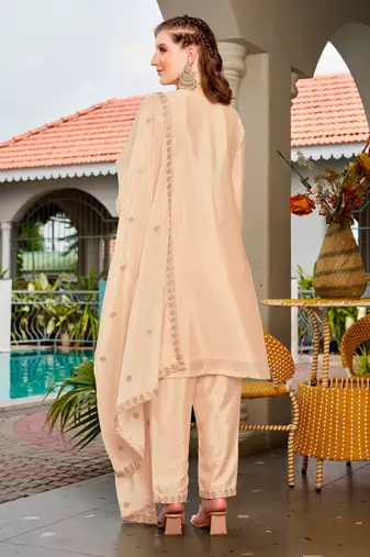 Cream color chinon fabric embroidered free size stithed suit