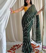 Dark green chiffon saree in leheriya with foil border work