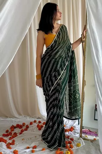 Dark green chiffon saree in leheriya with foil border work