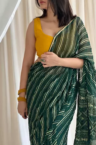 Dark green chiffon saree in leheriya with foil border work