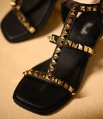 Gold studded black heels with ankle straps