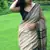 Beige hand block printed linen saree with stripe blouse
