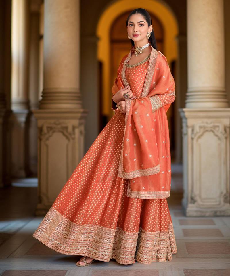 Orange color heavy glamorous ceremonial wear anarkali viscose shimmer dress
